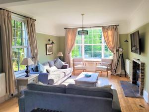 a living room with two couches and a table at 9 Bed in Keswick SZ238 in Keswick