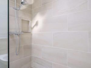 a shower with a glass door in a bathroom at 3 Bed in Bassenthwaite 84024 in Bassenthwaite