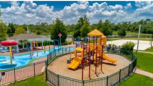 a playground with a water park with a slide at Your home 5 * near Disney in Kissimmee