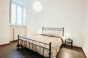 Кровать или кровати в номере Bigattera trilocali - Affitti Brevi Italia