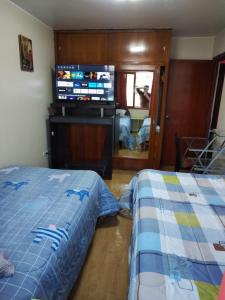 En tv och/eller ett underhållningssystem på FABRIZIO GUEST HOUSE