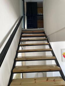 a group of wooden stairs in a room at Alfar Hostel in Mar del Plata