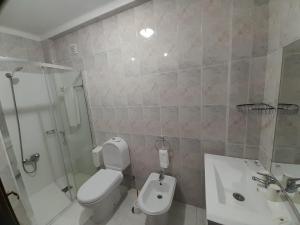 Um banheiro em Hotel Dom Joao IV