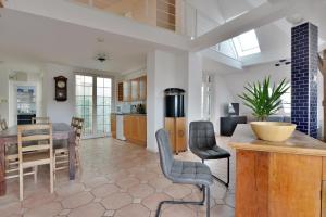 a kitchen and living room with a table and chairs at 5,Batthyani Square, Buda, Panorama, Parliament in Budapest