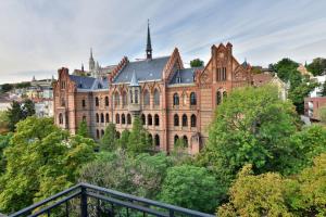 an old building in a city with trees at 5,Batthyani Square, Buda, Panorama, Parliament in Budapest