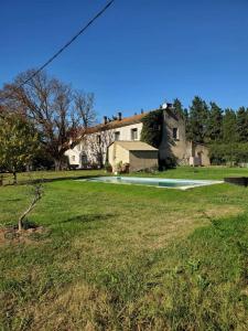 a house in the middle of a field at Le petit mas en provence avec piscine in Barbentane