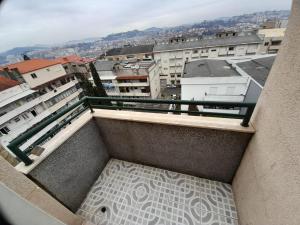 a balcony with a view of a city at Hotel Dom Joao IV in Guimarães