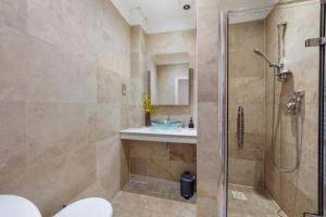 a bathroom with a shower and a sink at The Elegant 3 Bed on the Stray! in Harrogate