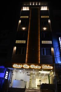 a building with a sign that reads trust the allegheny office at Hotel The Heera Divine in Kānpur