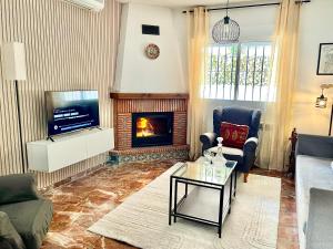 TV a/nebo společenská místnost v ubytování Casa rural Lomalinda
