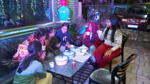 a group of women sitting around a table at GREEN VIEW HOME STAY in Siliguri