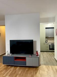 a living room with a large flat screen tv at Short stay accommodation in Dolno Nerezi