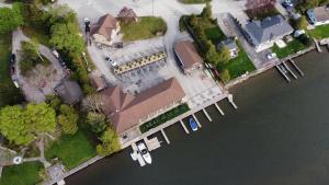 an aerial view of a house next to the water at Kit Wat Motel & Marina in Sauble Beach