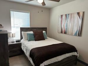 Letto o letti in una camera di Brand New Rest and Relaxation Apartments