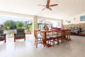 a dining room with a table and chairs at Villa Erika with private pool and garden - Happy Rentals in Lecce
