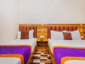 Postel nebo postele na pokoji v ubytování Hotel Era Mumbai