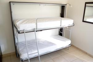 a closet with two bunk beds in a room at Appartamenti Vacanza in Roseto degli Abruzzi