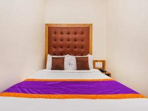 Postel nebo postele na pokoji v ubytování Hotel Era Mumbai