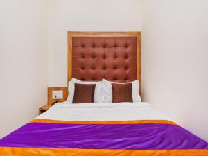 Postel nebo postele na pokoji v ubytování Hotel Era Mumbai