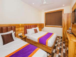 Postel nebo postele na pokoji v ubytování Hotel Era Mumbai