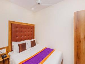 Postel nebo postele na pokoji v ubytování Hotel Era Mumbai
