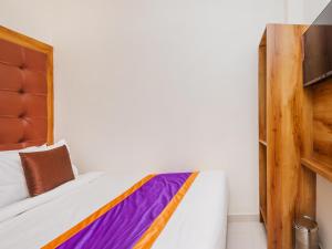 Postel nebo postele na pokoji v ubytování Hotel Era Mumbai