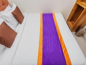 Postel nebo postele na pokoji v ubytování Hotel Era Mumbai