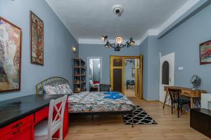 a bedroom with a bed and a dining room at Top Center, 3BDR, Heart of the city, FREE Secured Parking in Sofia