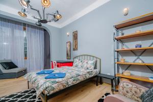 a living room with a bed and a couch at Top Center, 3BDR, Heart of the city, FREE Secured Parking in Sofia