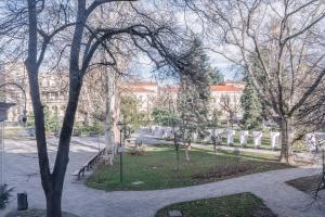 a cemetery with tombstones and trees in a city at Top Center, 3BDR, Heart of the city, FREE Secured Parking in Sofia