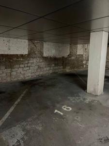 an empty parking garage with a parking number on it at Adorable Appartement Strasbourg NEUDORF PARKING SOUS SOL in Strasbourg +30 photos