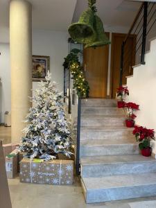 a christmas tree on the stairs of a building at Hotel Cosmos Tarragona in Tarragona