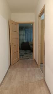 an empty room with a door and a hallway at 3-х комнатная квартира в Павлодаре in Pavlodar