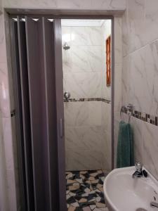 a bathroom with a sink and a shower at G Guest House in King Williamʼs Town