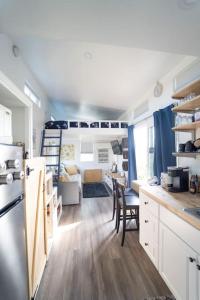 a kitchen and living room of an rv at TinyHome at the Sanctuary in Lakeside