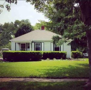 a small white house with a green yard at 10 min Downtown-3 min Irvington in Indianapolis