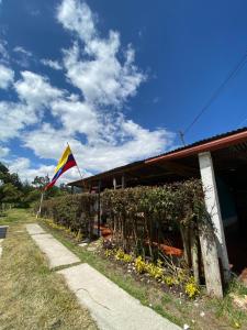 a kite is flying next to a building at Casa Campestre Adela in Suesca