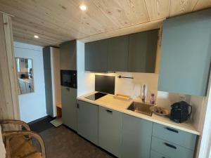 a kitchen with a sink and a counter top at Studio Tignes, 1 pièce, 4 personnes - FR-1-502-552 in Tignes