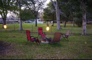 a group of chairs in a park with lights at Cozy quiet retreat. in Beaumont