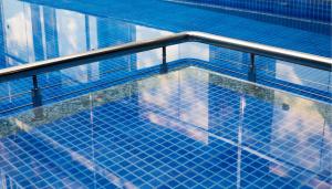 an overhead view of a swimming pool at The Porto by lagom , Vagator beach goa near Thalassa in Vagator