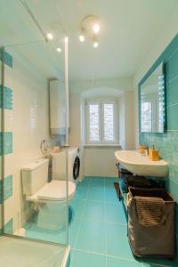 a bathroom with a toilet and a sink at Apartman Škor in Komiža +13 photos