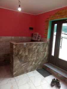 a bar in a room with shoes on the floor at Аура Карпат in Slavske
