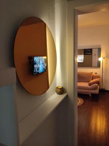 a living room with a mirror on the wall at Easy and Cozy in Duisburg