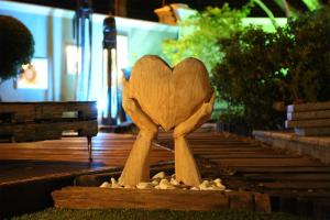 a wooden spoon sitting on top of a bench at Kaya La Provence in Cape Town