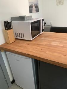 a microwave sitting on top of a counter at Erehwon - History in Bodmin in Bodmin