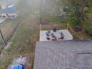 an aerial view of a backyard with a fire pit at Cozy quiet retreat. in Beaumont