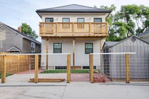 a house with a deck on top of a volleyball net at Dt 1 Br 1bath Cozy Suite 8 Min Walk To Arena in Edmonton