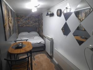 Postel nebo postele na pokoji v ubytování APARTMAN POZORISTE Penthaus