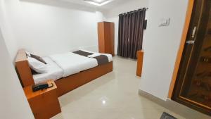 a bedroom with a bed in a room at The PENTHOUSSE near ION Exam Centre & Airport in Guwahati