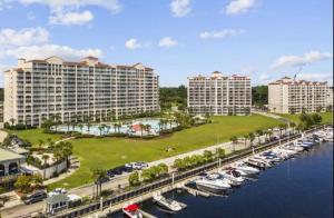 an aerial view of a marina with buildings and boats at Stylish Barefoot Townhome, Sleeps 10 NEW! in Myrtle Beach